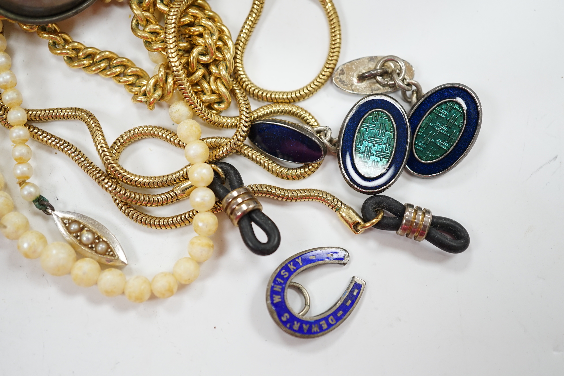 A small 9ct gold and gem set pendant, 22mm, three gilt metal chains, two white metal cufflinks, a Citizen watch, other costume jewellery and three ceramic items.